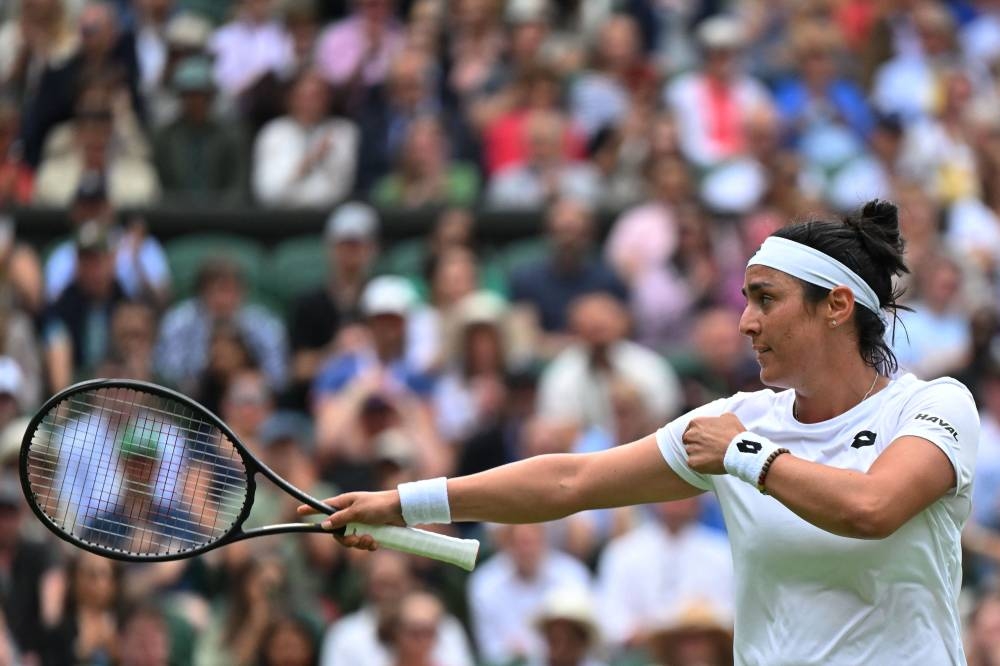 Tunisia’s Ons Jabeur reacts as she competes against France’s Diane Parry during their women’s singles tennis match on the fifth day of the 2022 Wimbledon Championships at The All England Tennis Club in Wimbledon, south-west London, July 1, 2022. — AFP pic 