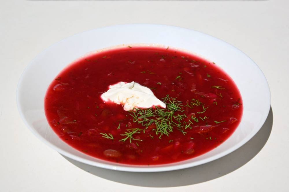 An illustration photo taken on July 1, 2022, shows plate of beetroot borscht soup with sour cream in Moscow. — AFP pic