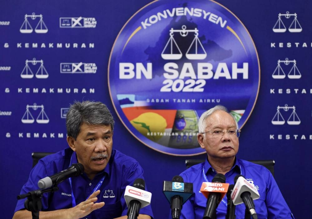 Barisan Nasional (BN) Deputy Chairman Datuk Seri Mohamad Hasan (left) during a press conference after attending the BN Convention at the Penampang Commercial and International Center (ITCC) July 2, 2022. — Bernama pic