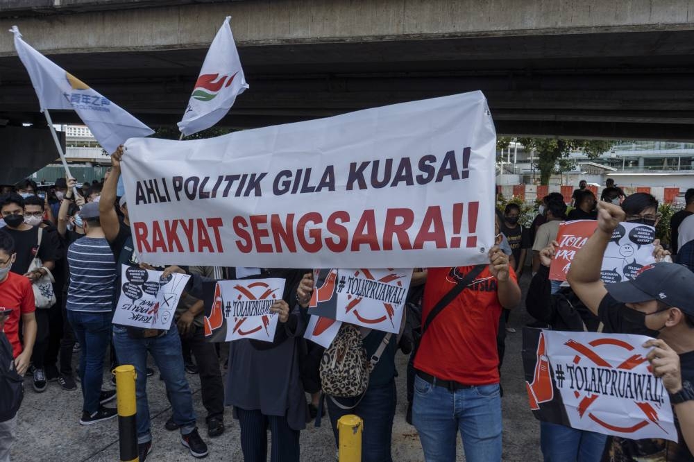 People holding placards during the student unions' speaker corner at Pasar Seni, Kuala Lumpur, July 2, 2022. — Picture by Shafwan Zaidon
