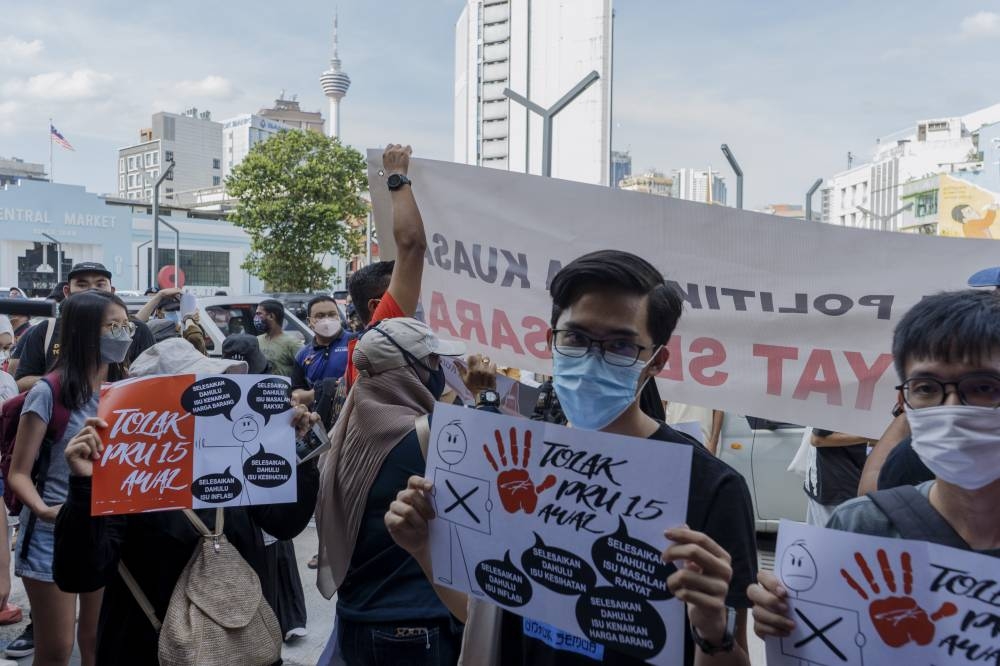 People holding placards at the student unions’ speaker corner at Pasar Seni, Kuala Lumpur, July 2, 2022. — Picture by Shafwan Zaidon