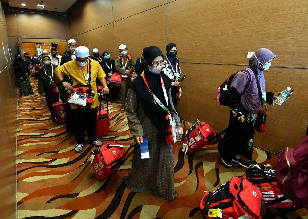 The first group of Malaysian Haj pilgirms are seen waiting for their flight to Saudi Arabia at the Movenpick Convention Centre in Sepang June 4, 2022. — Bernama pic