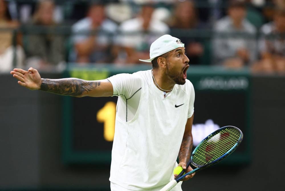 Australia's Nick Kyrgios reacts during his third round match against Greece's Stefanos Tsitsipas at the All England Lawn Tennis and Croquet Club, London July 2, 2022. — Reuters pic