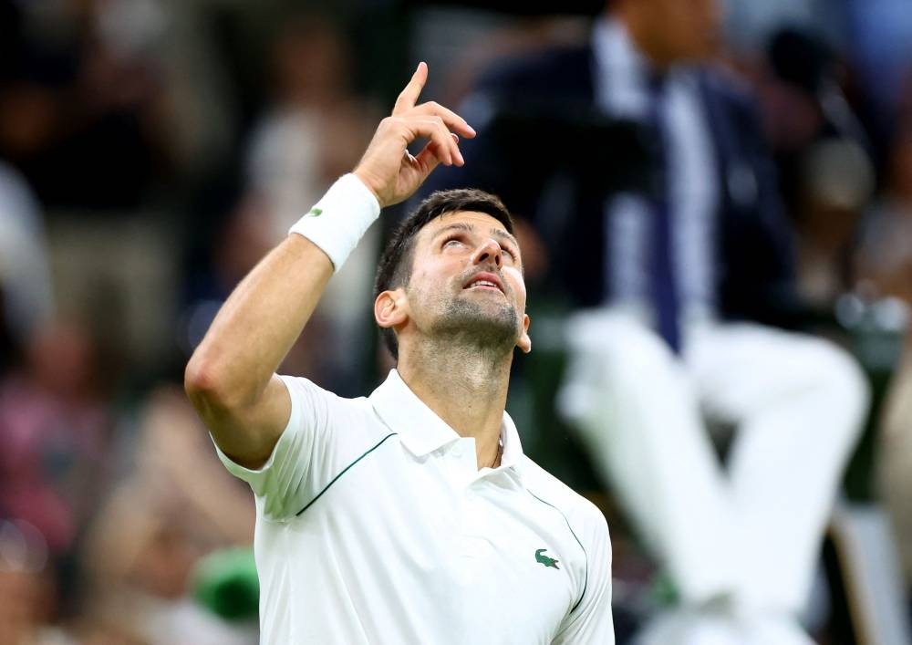 Novak Djokovic celebrates after winning his fourth round match against Tim van Rijthoven at the All England Lawn Tennis and Croquet Club, London July 3, 2022. — Reuters pic