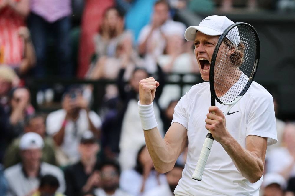 Italy’s Jannik Sinner celebrates beating Spain’s Carlos Alcaraz during their round of 16 men’s singles tennis match on the seventh day of the 2022 Wimbledon Championships at The All England Tennis Club in Wimbledon, July 3, 2022. — AFP pic 