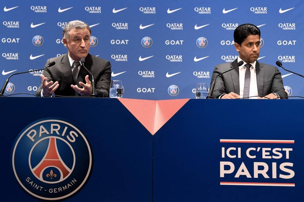 French coach Christophe Galtier (left) speaks next to PSG’s President Nasser Al-Khelaifi during a press conference after being appointed as French L1 football club Paris Saint-Germain’s head coach, at the Parc des Princes stadium in Paris, July 5, 2022. — AFP pic 