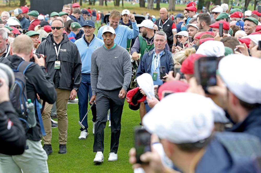 US golfer Tiger Woods walks through the crowd on the second day of the JP McManus Pro-Am golf tournament at the The Golf Course at Adare Manor in Limerick, south-west Ireland July 5, 2022. — AFP pic