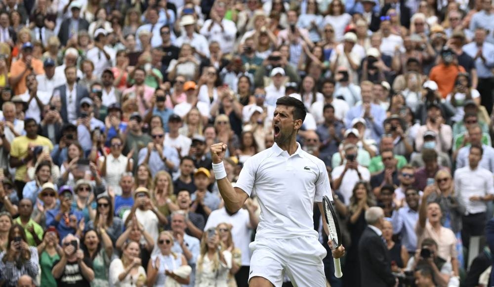 Novak Djokovic celebrates winning his quarter final match against Jannik Sinner at the  All England Lawn Tennis and Croquet Club, London July 5, 2022. — Reuters pic