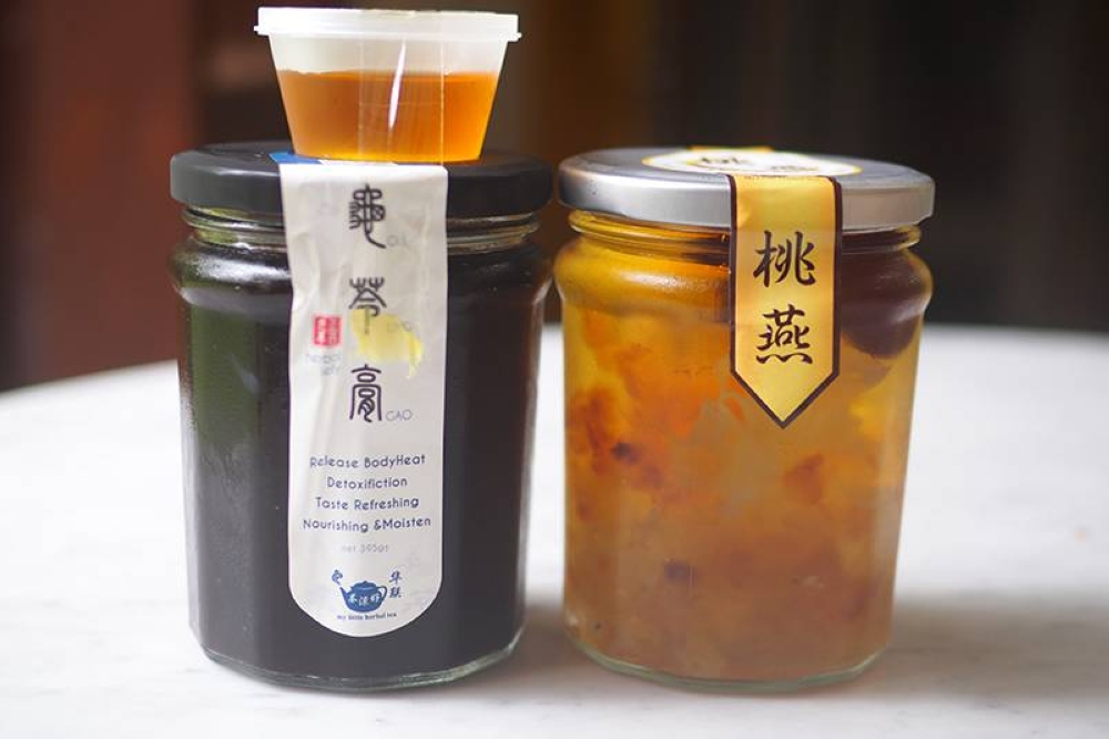 The desserts are bottled and stored in a chiller.