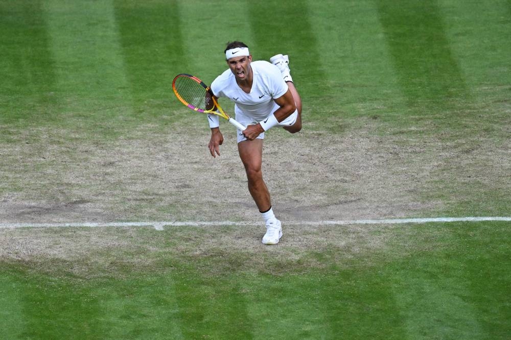 Spain’s Rafael Nadal serves the ball to Netherlands’ Botic van de Zandschulp during their round of 16 men’s singles tennis match on the eighth day of the 2022 Wimbledon Championships, July 4, 2022. — AFP pic 