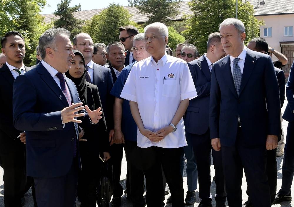 Prime Minister Datuk Seri Ismail Sabri Yaakob with Turkey’s Minister of National Defence Hulusi Akar (right) during a visit to MKE Corporation in Ankara, July 6, 2022. — Bernama pic 