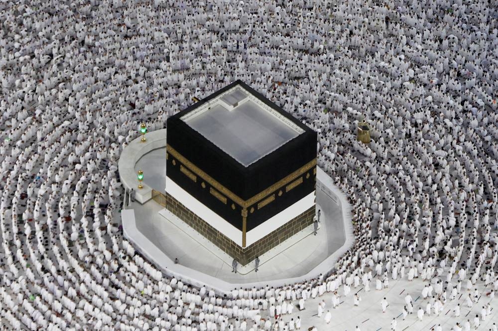 Muslim pilgrims circle the Kaaba and pray at the Grand Mosque ahead of the annual Haj pilgrimage, in the holy city of Mecca, Saudi Arabia July 6, 2022. — Reuters pic