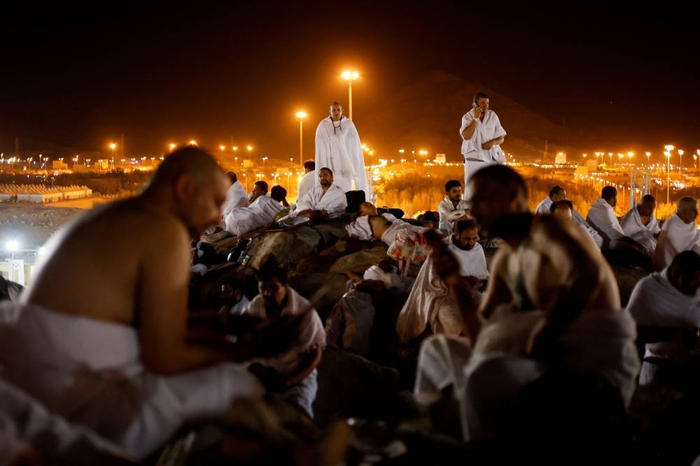 Muslim pilgrims gather on Mount of Mercy at the plain of Arafat during the annual haj pilgrimage, outside the holy city of Mecca, Saudi Arabia, July 8, 2022. — Reuters pic