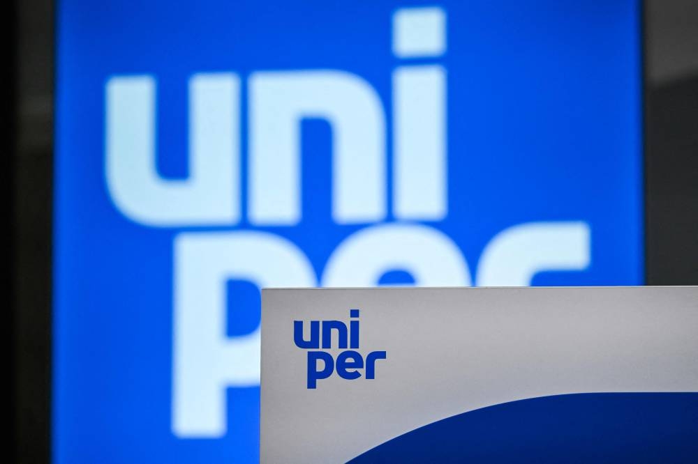 The logo of energy supplier Uniper is pictured prior to a press conference about the government's rescue plan at the company's headquarters in Duesseldorf, western Germany on July 8, 2022. — AFP pic