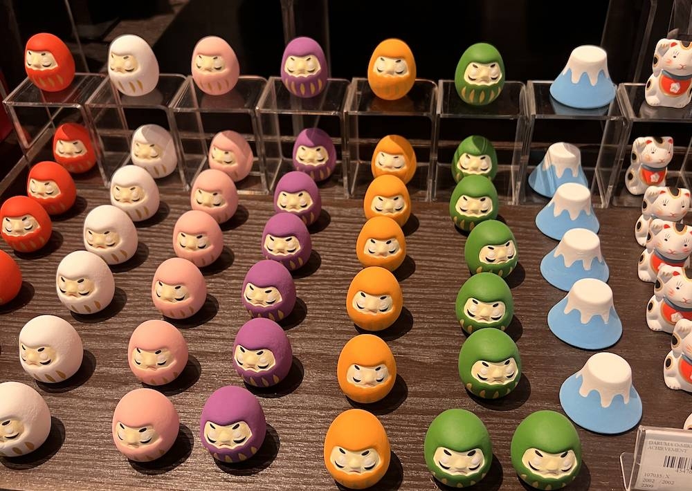 You are greeted at the entrance by a row of adorable daruma dolls. 