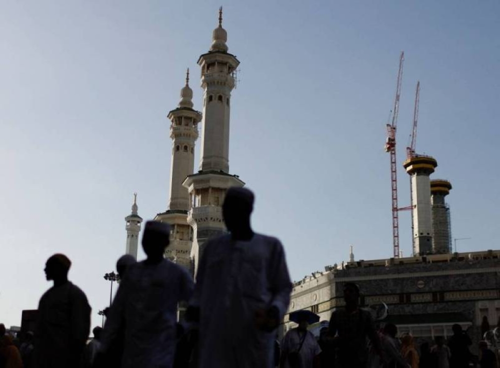Muslim pilgrims walk outside the Grand Mosque in the holy city of Mecca, Saudi Arabia July 5, 2022. — Reuters pic