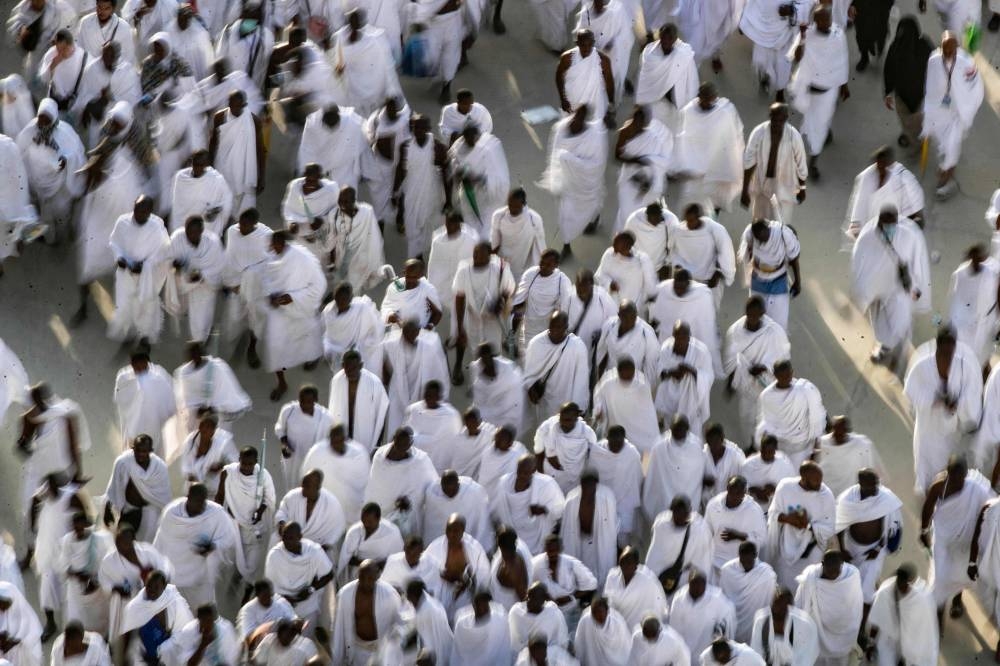 Thousands of Muslim pilgrims make their way across the valley of Mina, near Mecca in western Saudi Arabia, to perform the ‘stoning of the devil’ ritual which marks the start of the Eid al-Adha holiday on July 9, 2022, as this year’s expanded hajj pilgrimage was winding down. ― AFP pic