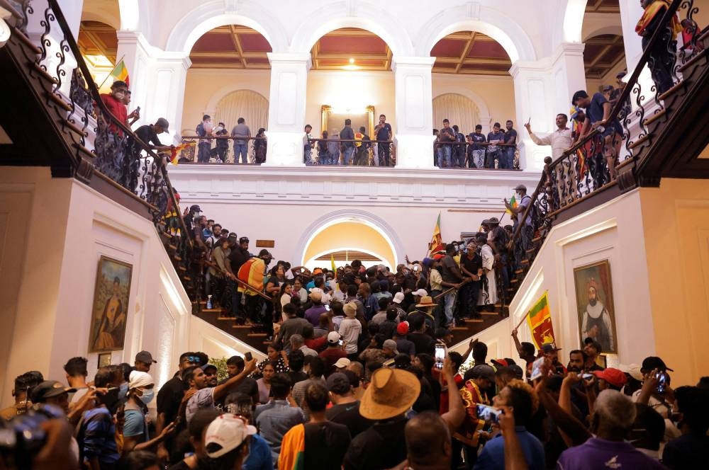 Demonstrators protest inside the President’s House, after President Gotabaya Rajapaksa fled, amid the country’s economic crisis, in Colombo, Sri Lanka, July 9, 2022. ― Reuters pic