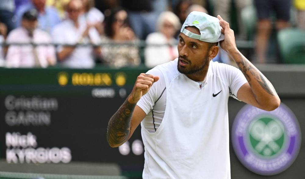 Australia’s Nick Kyrgios celebrates winning Chile’s Cristian Garin during their men’s singles quarter final tennis match on the tenth day of the 2022 Wimbledon Championships at The All England Tennis Club in Wimbledon, July 6, 2022. — AFP pic 