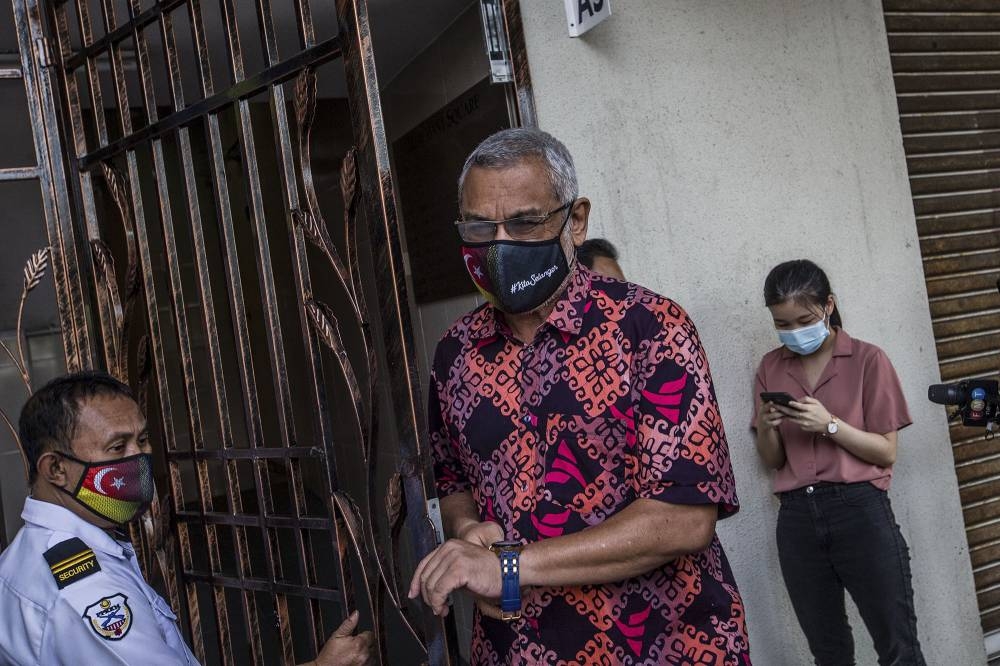 Parti Amanah Negara communications director Khalid Samad leaves PKR’s headquarters after a meeting with the Pakatan Harapan presidential council in Petaling Jaya January 12, 2021. — Picture by Firdaus Latif