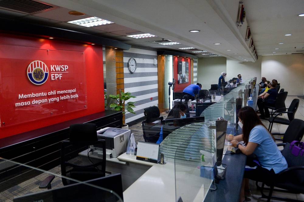 Tengku Zafrul said the government was actively studying policies that could speed up the process of increasing social protection coverage, which would be announced later. — Picture by Miera Zulyana