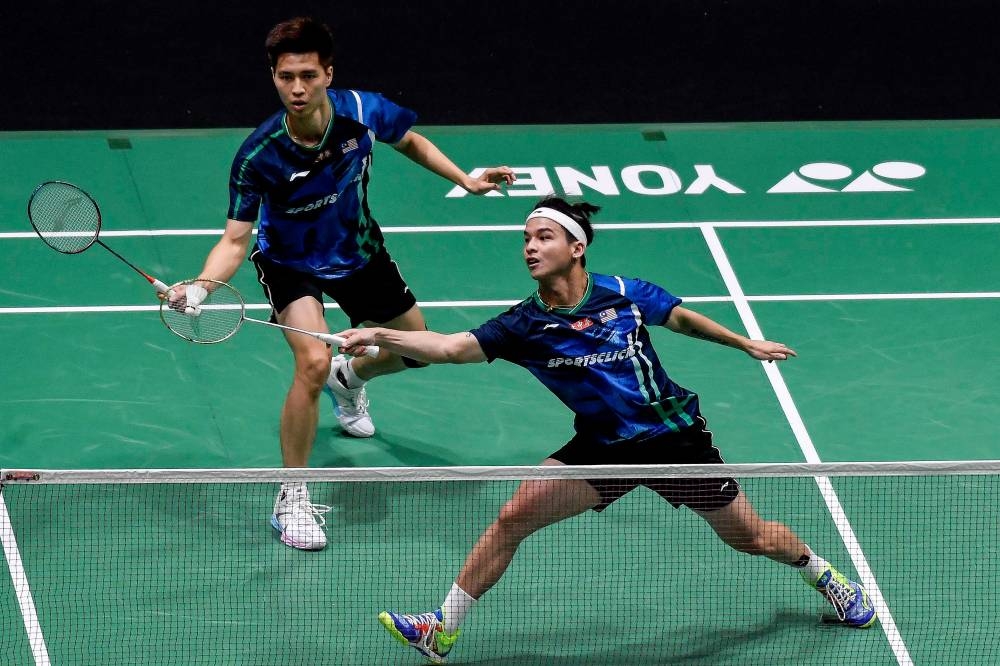 National men’s doubles Ong Yew Sin (left) and Teo Ee Yi take on Taiwanese men’s doubles players Lee Yang and Wang Chi-Lin at the second round match of the 2022 Malaysia Open Badminton Championships at Axiata Arena Bukit Jalil, June 30, 2022. — Bernama pic