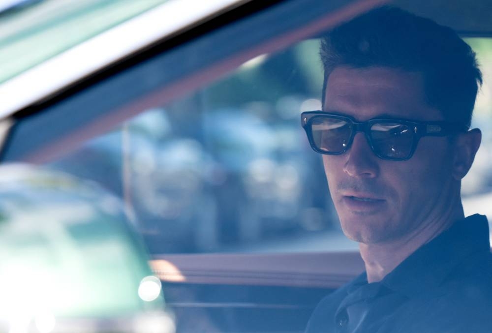 Bayern Munich’s Polish forward Robert Lewandowski sits in a car as he leaves the Barmherzige Brueder hospital where he underwent a medical check prior to the start of his club’s training session in Munich, Germany, July 12, 2022. — AFP pic 