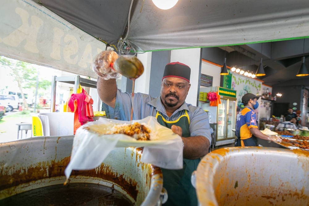 Mathana Shaib said that he suffered health issues owing to pressure, after having to deal with a critical lack of workers for his popular Nasi Kandar restaurant. — Picture by Devan Manuel