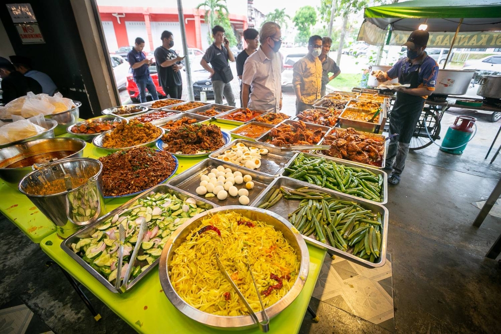 Nasi Kandar Basikal in Bangi prepares forty different types of dishes every day. — Picture by Devan Manuel