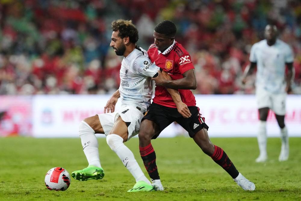 Liverpool’s Mohamed Salah in action with Manchester United’s Tyrell Malacia at Rajamangala National Stadium, Bangkok, Thailand, July 12, 2022. — Reuters pic 