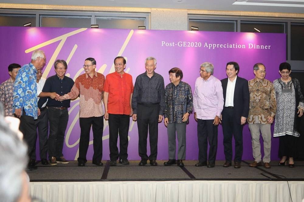 People’s Action Party secretary-general Lee Hsien Loong (sixth from right) with some of the 20 Members of Parliament (MPs) who retired at the 2020 General Election at an event on July 12, 2022 to thank all 20 MPs. — TODAY pic