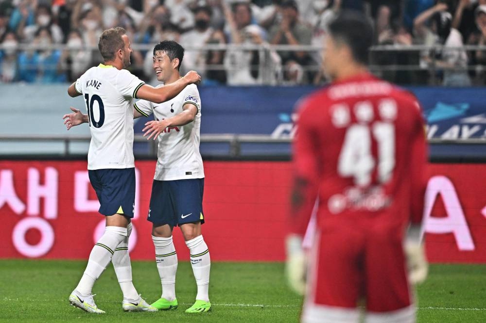 Tottenham Hotspur’s Harry Kane celebrates his goal with teammate Son Heung-min against Team K League during the exhibition match at Seoul World Cup Stadium in Seoul, July 13, 2022. — AFP pic 