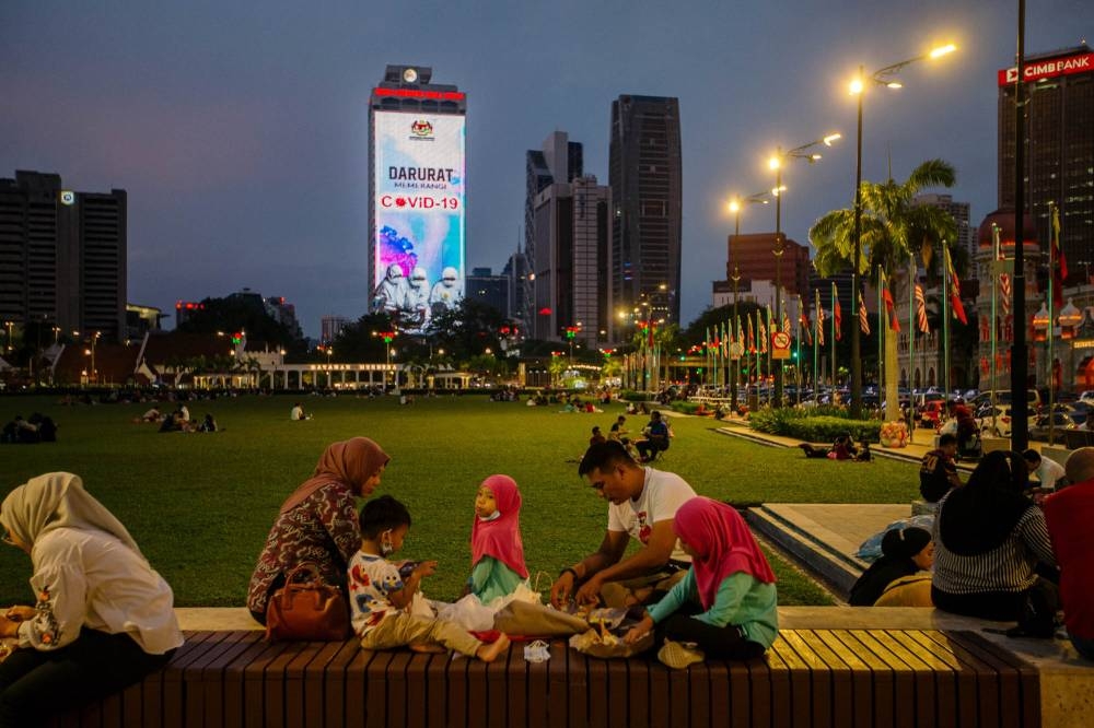 People break fast during the holy month of Ramadan at Dataran Merdeka in Kuala Lumpur April 18, 2021. — Picture by FIrdaus Latif