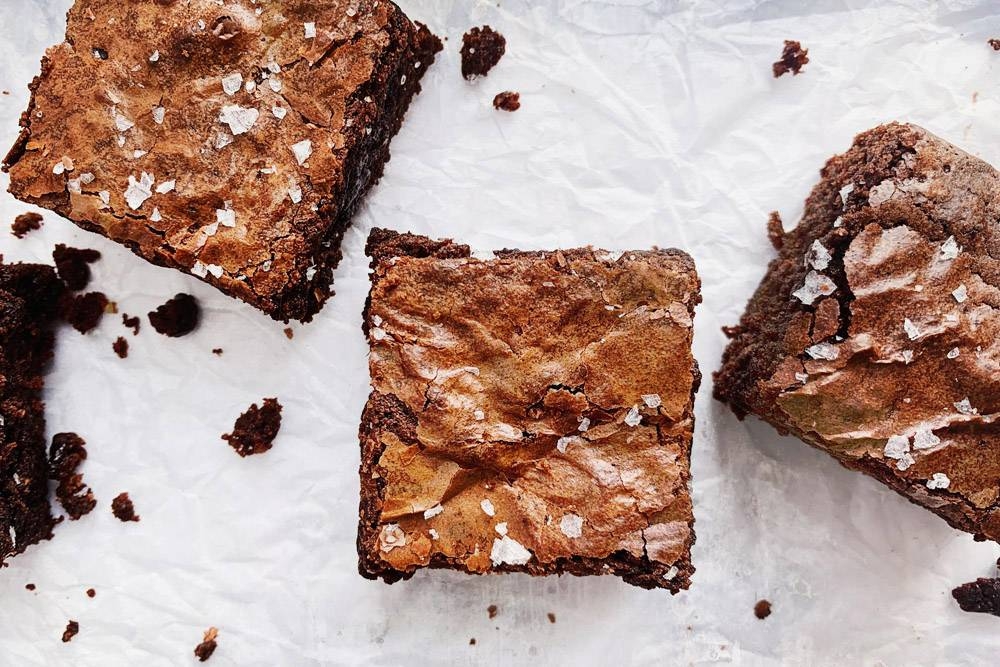 Brunettes are classic dense and fudgy brownies made with Valrhona cocoa powder.
