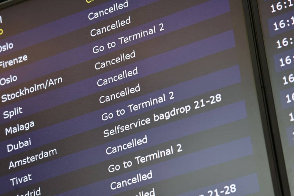 Flights are listed as pilots from Scandinavian airline SAS go on strike, at Terminal 3 of Copenhagen Airport, in Kastrup, Denmark July 4, 2022. — Ritzau Scanpix/Olafur Steinar Gestsson pic via Reuters