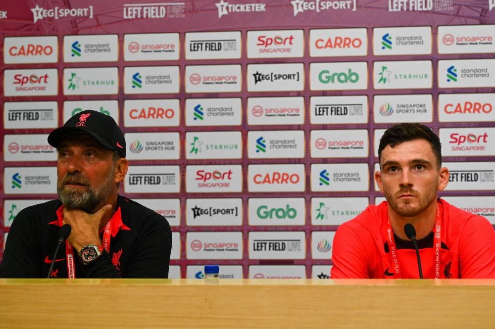 Liverpool FC manager Jurgen Klopp and player Andy Robertson attend a press conference at the National Stadium in Singapore, July 14, 2022, ahead of the exhibition match between English Premier League teams Liverpool FC and Crystal Palace FC. — AFP pic 