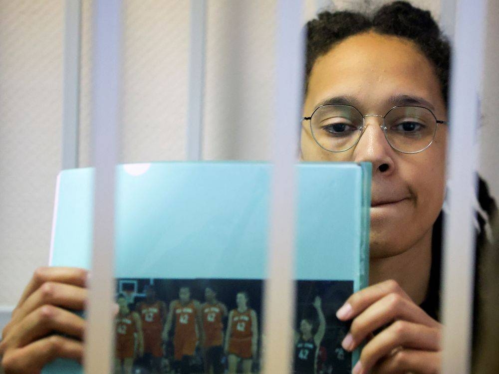 US basketball player Brittney Griner, who was detained at Moscow's Sheremetyevo airport and later charged with illegal possession of cannabis, holds up a picture, on the day of a court hearing in Khimki outside Moscow, Russia, July, 15, 2022. — Reuters pic