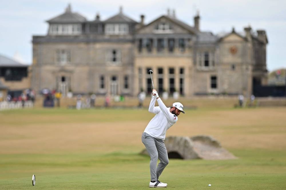 US golfer Cameron Young plays from the 18th tee during his opening round 64 on the first day of The 150th British Open Golf Championship on The Old Course at St Andrews in Scotland, July 14, 2022. — AFP pic 