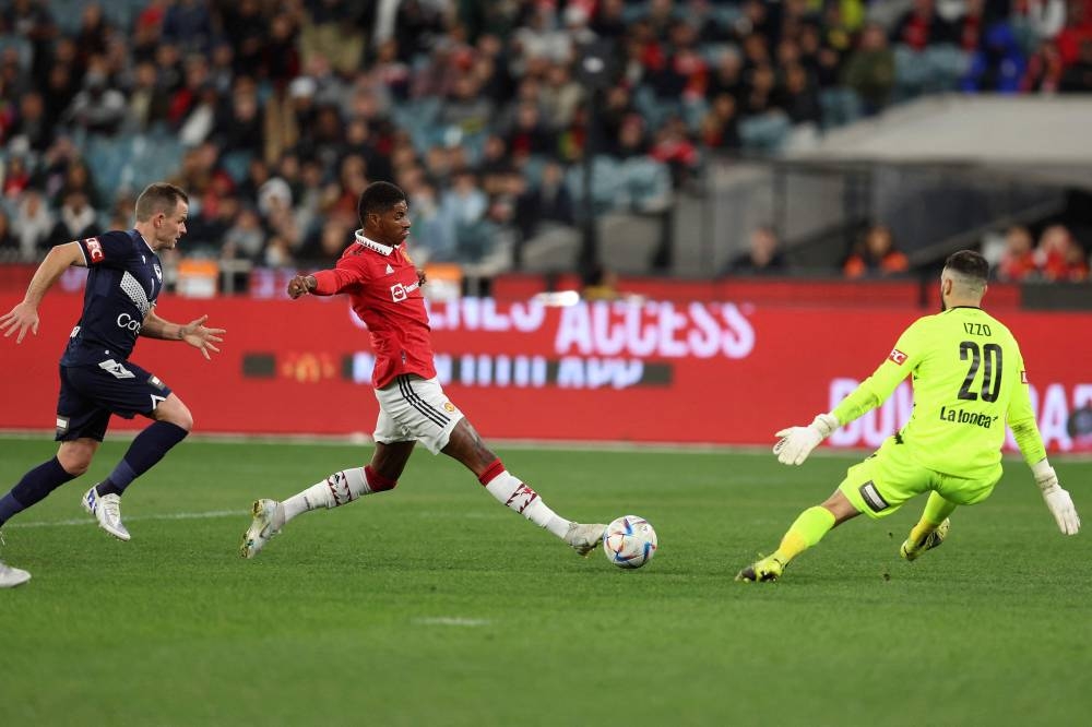 Marcus Rashford of Manchester United scores a goal during the exhibition football match between English Premier League team Manchester United and Melbourne Victory at the Melbourne Cricket Ground, July 15, 2022, in Melbourne. — AFP pic 