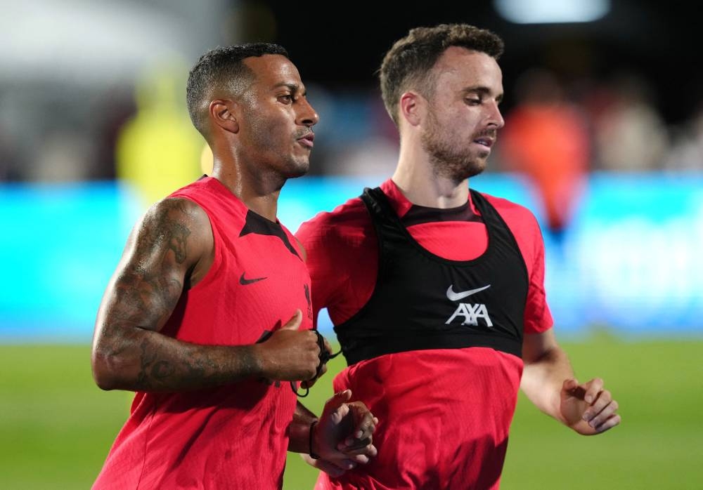 Liverpool's Diogo Jota and Thiago Alcantara seen during a training session at the Rajamangala National Stadium in Bangkok July 11, 2022. ― Reuters pic