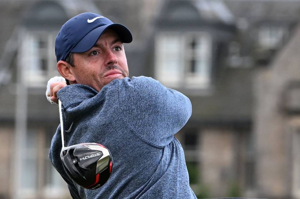Northern Ireland's Rory McIlroy watches his drive from the second tee during his second round on day 2 of The 150th British Open Golf Championship on The Old Course at St Andrews in Scotland July 15, 2022. ― AFP pic