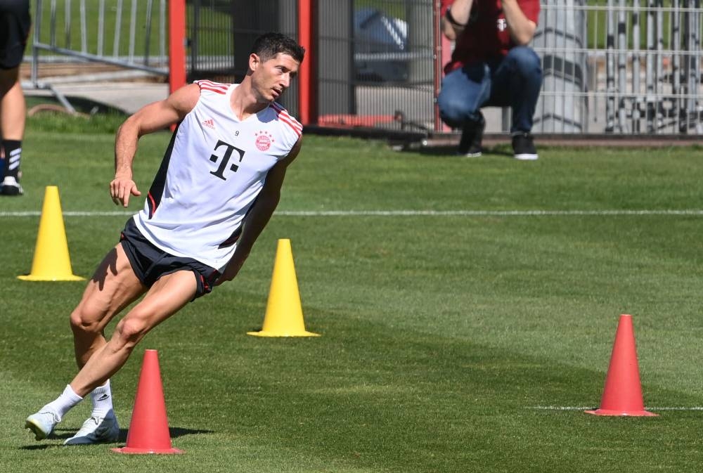 Bayern Munich’s Polish forward Robert Lewandowski warms up during a training session of German first division Bundesliga football team FC Bayern Munich at the club’s area in Munich, southern Germany, on July 14, 2022. — AFP pic
