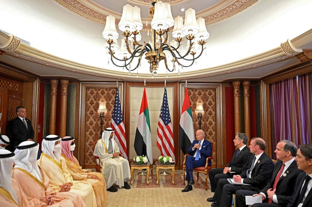 US President Joe Biden (centre to right) and Secretary of State Antony Blinken (4th-right) meet with UAE President Sheikh Mohamed bin Zayed al-Nahyan (centre to left) and other officials during a bilateral meeting at a hotel in Saudi Arabia’s Red Sea coastal city of Jeddah on July 16, 2022.. — AFP pic