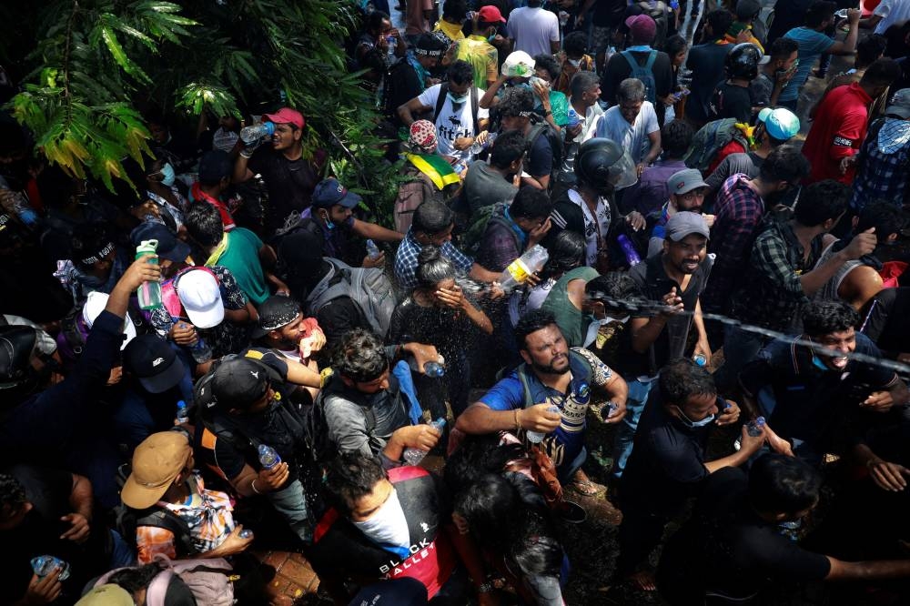 File photo of protestors being sprayed with water after police used tear gas to disperse them during a protest outside Sri Lanka’s Prime Minister Ranil Wickremesinghe’s office premises, amid the country's economic crisis, in Colombo, Sri Lanka July 13, 2022. — Reuters pic