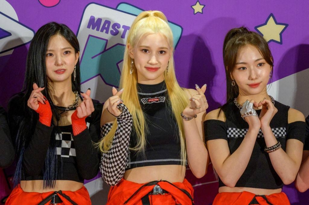 In this file photo taken on May 8, 2022, members of South Korean K-Pop girl group Kep1er gesture with 'fingerhearts' on the red carpet at KCON Seoul 2022 in Seoul. — AFP pic