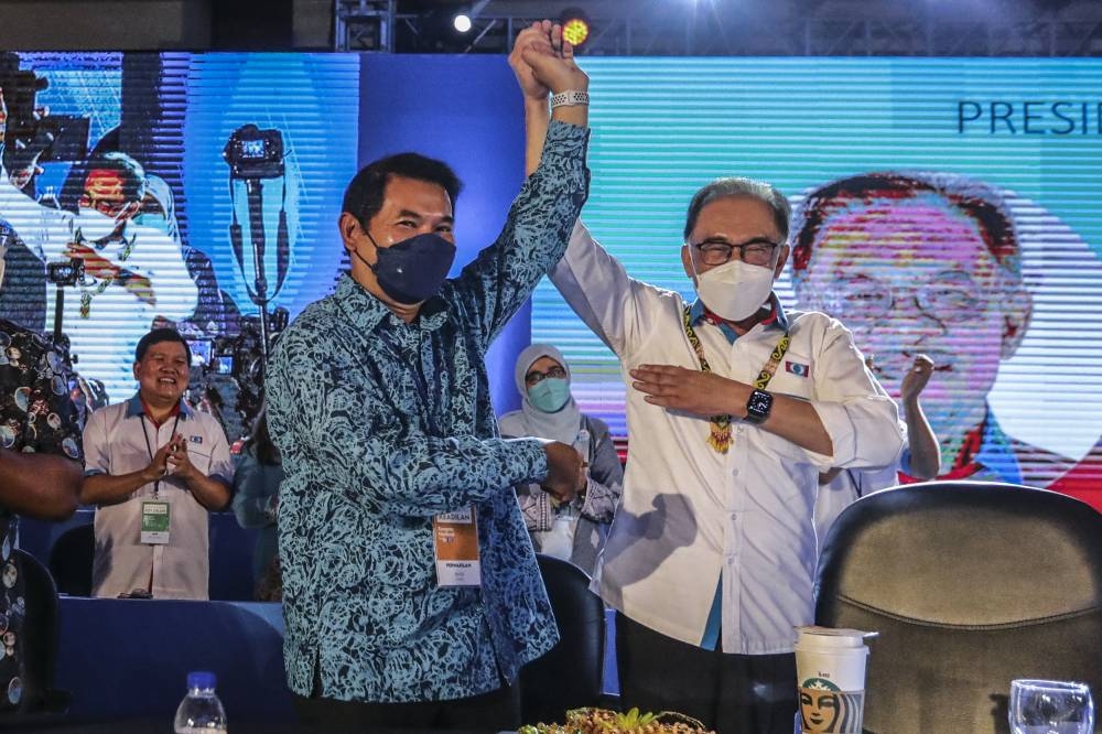 Newly minted deputy president Rafizi Ramli (left) with PKR president Datuk Seri Anwar Ibrahim (right) at the 16th PKR Congress in Ideal Convention Centre (IDCC) Shah Alam July 17, 2022. — Picture by Hari Anggara 