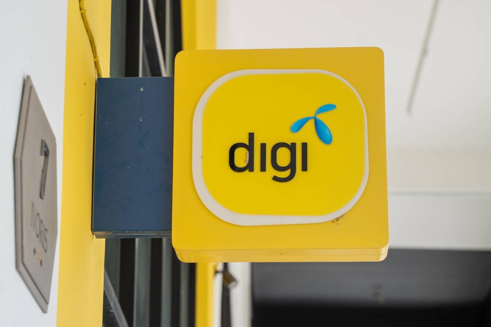 MIDF Research said Digi’s Q2 2022 normalised profits were 23.9 per cent lower year-on-year (y-o-y) at RM213.0 million, mainly due to higher net financing expenses and higher tax provision related to Cukai Makmur. — Picture by Devan Manuel