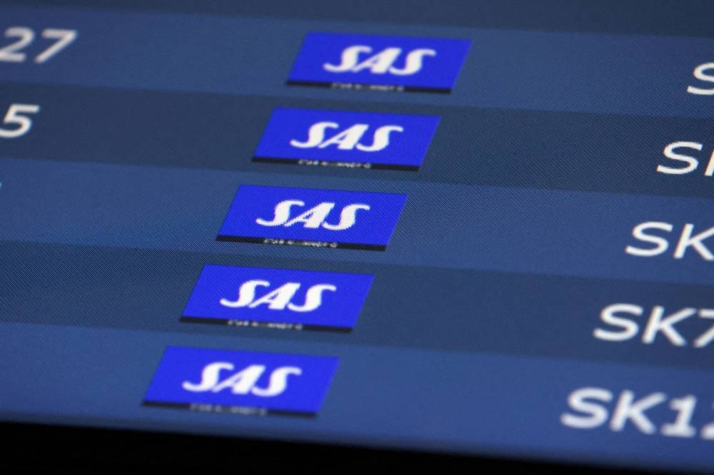 SAS flights listed at Copenhagen airport, July 3, 2022. — Reuters pic