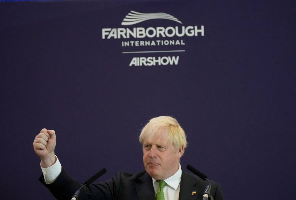 Britain's Prime Minister Boris Johnson speaks as he attends the Farnborough International Airshow, in Farnborough, Britain, July 18, 2022. — Frank Augstein/Pool pic via Reuters