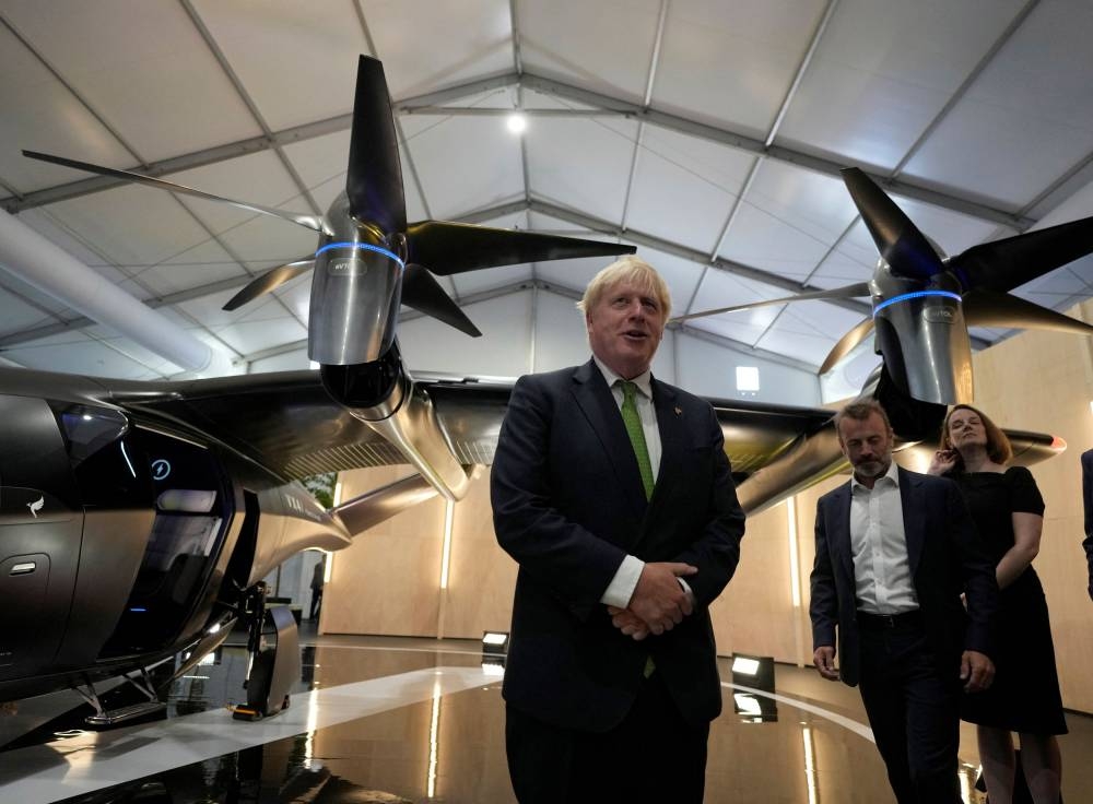 ritain's Prime Minister Boris Johnson views the display by SaxaVord, the UK Spaceport, at the Farnborough International Airshow, in Farnborough, Britain, July 18, 2022. — Frank Augstein/Pool pic via Reuters
